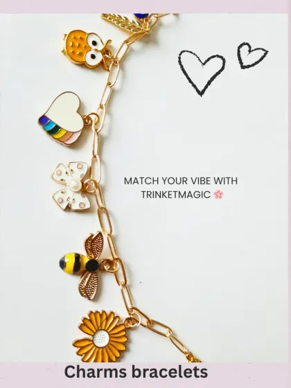 A vertical view of the custom bracelet, showcasing the lineup of colorful enamel charms like the bee, daisy, and rainbow heart, all dangling from a stylish paperclip chain.