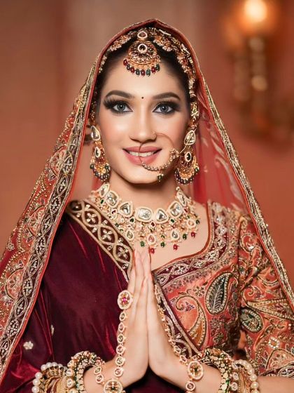 A welcoming and happy bride. Her smile lights up the look, which is both traditional and glamorous.