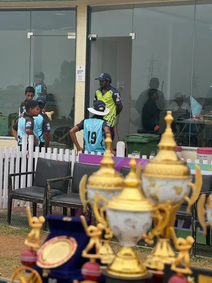 A candid shot of the players watching the game from the sidelines. Every moment is a learning experience.