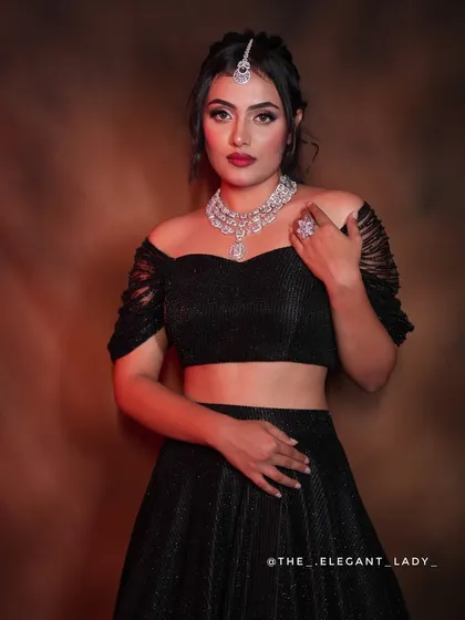 For a modern and glamorous reception or sangeet look, I offer sparkling silver-toned sets like this one. This layered necklace and maang tikka combination gives the feel of real diamonds, perfect for pairing with a contemporary lehenga or gown.