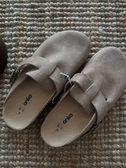A top-down view of the taupe clogs, showing the soft material and classic design. These are always a popular item when I open orders.