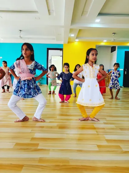 Young students holding a basic Bharatanatyam stance. Building a strong foundation in posture and alignment is the first step towards mastering the dance.