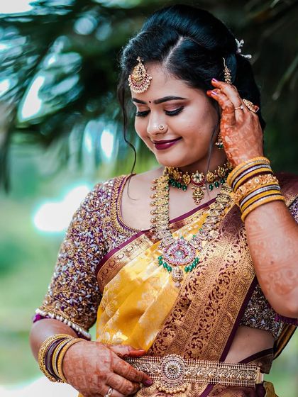 Our client Inchara on her engagement day, looking radiant in a traditional temple jewellery set. The combination of the choker, haram, and vaddanam is perfect for the occasion.