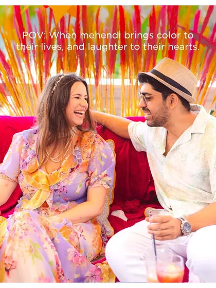A moment of shared laughter between the couple during their Mehendi. It's the joy and connection that make these rituals so special.