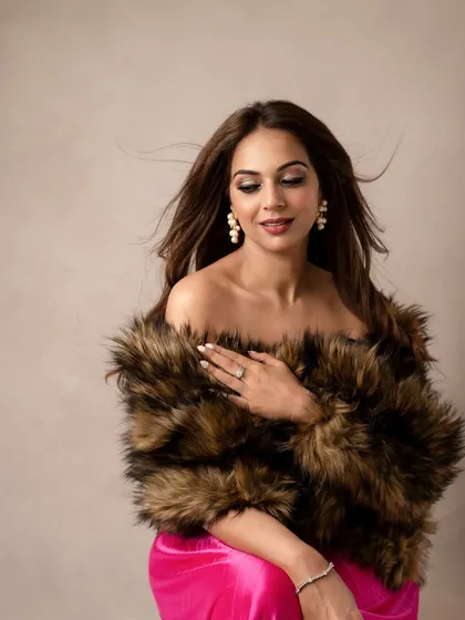 A touch of old-school glamour for her birthday shoot. The faux fur wrap and soft expression create a timeless and sophisticated portrait, showing another side of her personality.