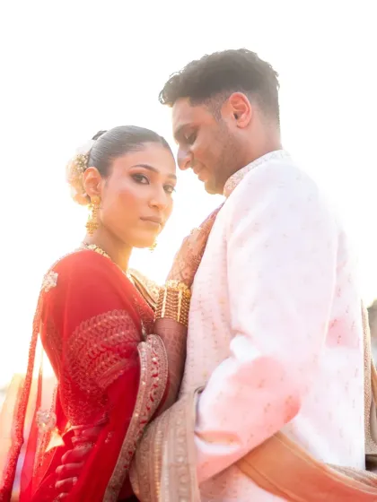 A beautiful backlit portrait at sunset. The golden light creates a halo effect, making this an incredibly romantic and artistic shot.