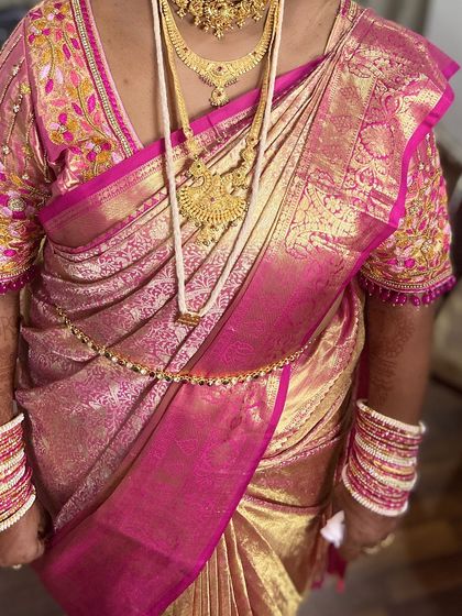 Another angle showing the rich fabric and the way the drape complements the heavy temple jewelry.