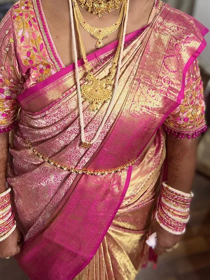 Another view of the perfectly draped silk saree, showing the rich texture and flawless finish.
