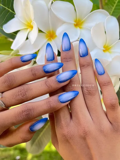 Feeling serene with these blue aura nails, perfectly posed with some beautiful white flowers. This is such a fresh and clean look for any occasion.