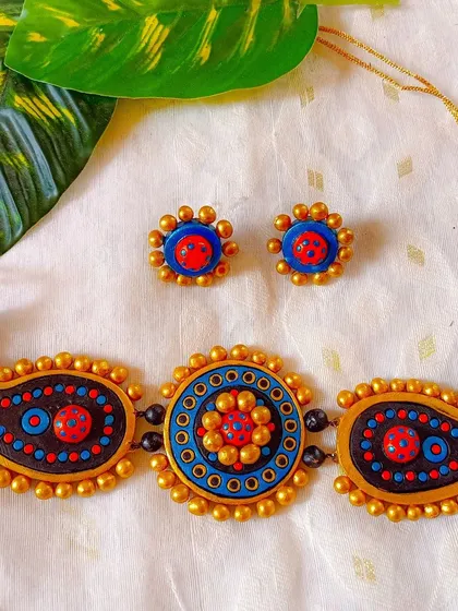 A beautiful blue and red version of the paisley and mandala choker.