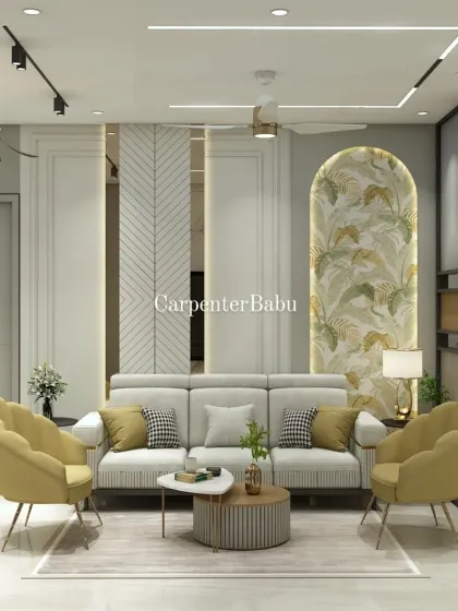 A living room in Powai that uses a pop of yellow in the armchairs to create a cheerful vibe. The tropical wallpaper in the arched niche brings a touch of nature indoors.