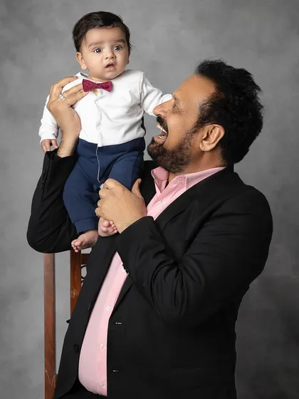The pure delight of a grandfather playing with his grandbaby. These are the candid, unscripted moments that tell the most beautiful stories.