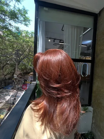 A beautiful ginger hair color, captured outside on our balcony to show how it looks in natural sunlight.