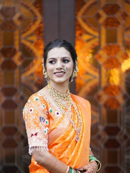 A bright and happy bridal portrait, capturing her looking out with a beautiful smile.