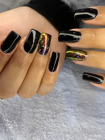 Another angle of the glossy black and multi-chrome cat eye nails, showing how the colors shift in the light.