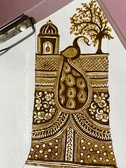 A practice sketch combining a peacock and a temple, two classic motifs in Indian mehendi. This is how I experiment with new compositions.