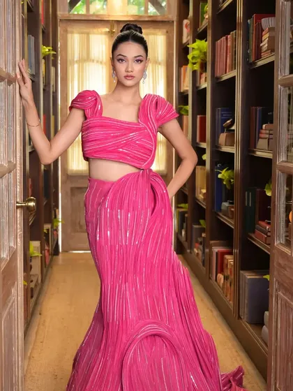 This shot in a library corridor shows how the hairstyle and outfit create a strong visual narrative. The classic top knot adds an element of timeless sophistication.