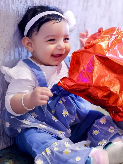A candid portrait of the birthday girl sharing a joyful smile. I love capturing the sweet, fleeting moments of childhood during kids' birthday photoshoots.