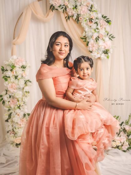 Creating memories stitched with love. This enchanting mother-daughter duo, Meghana and her little one, are twinning in elegant peach organza gowns I designed for their special Mother's Day photoshoot.