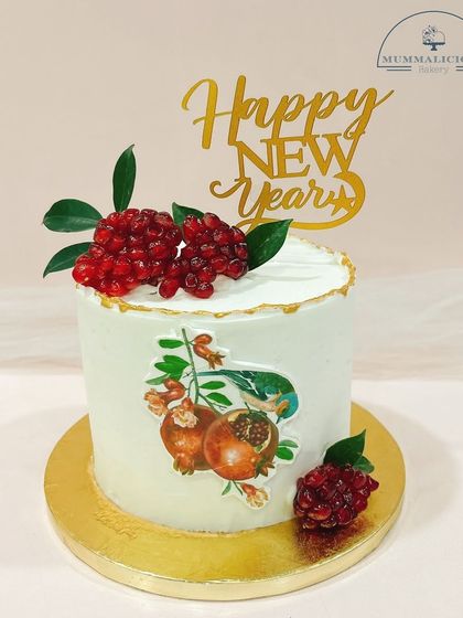 A fresh and elegant start to the New Year. This beautiful cake is adorned with real pomegranate seeds and a printed design, offering a unique and fruity flavour.