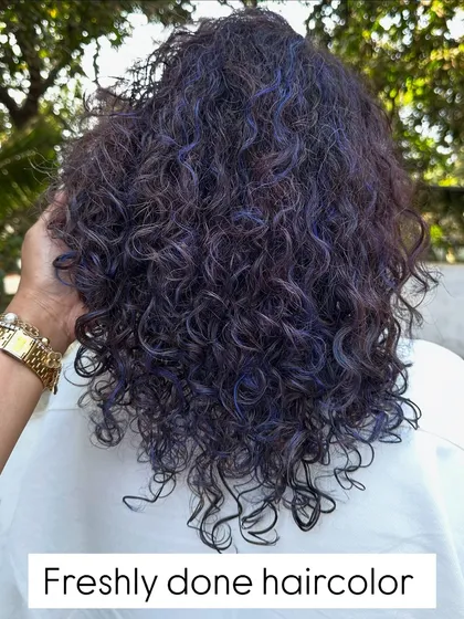 For my experimental clients like Bhakti, we love to play. This time we went for a cool purple and blue mix on her curly hair. The color looks so different after a few washes, fading into a beautiful pastel tone.