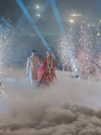 A truly magical exit, with the couple walking through a cloud of low fog and surrounded by cold pyrotechnics. I use special effects like these to create cinematic, dreamlike moments.