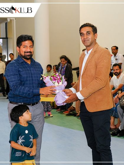 We were honored to have special guests join our Chess Carnival 2024. Here, we are welcoming a guest with a bouquet, highlighting the community spirit of our events.