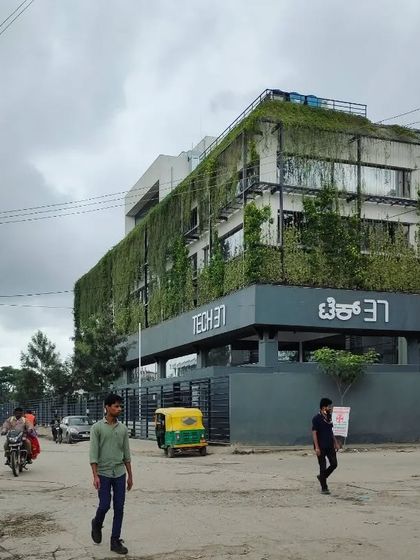 The 'Tech 37' building, a project that embodies our philosophy, seen from the street. It stands as a testament to how landscape architecture can create a green oasis that positively impacts the wider urban environment.