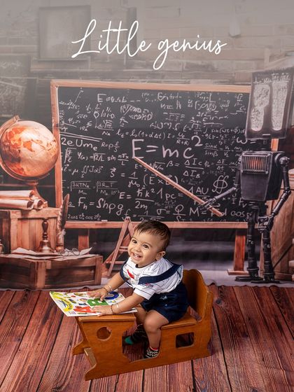 A little genius at his desk. This happy baby is ready to learn his ABCs in our fun and educational "Little Scholar" setup.