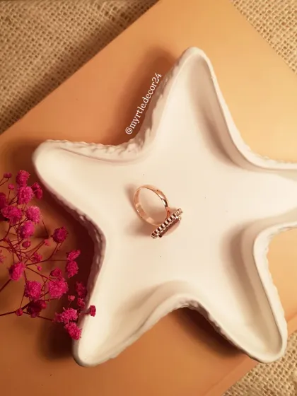 Another angle of our white starfish trinket tray, showing its textured surface and graceful shape.