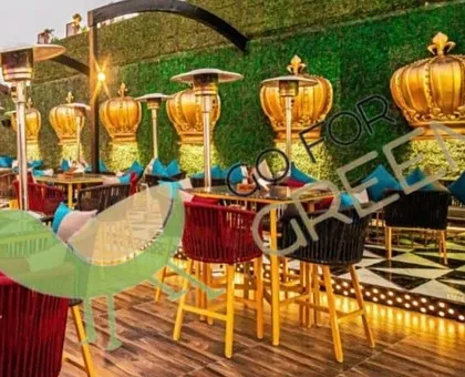 I partner with businesses to create unforgettable ambiances. For this premium cafe in Agra, I supplied a full range of outdoor bar chairs and seating against a backdrop of my artificial green walls. This setup creates a luxurious, inviting atmosphere for guests to enjoy.