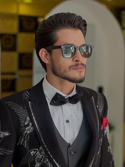 A closer look at this gentleman's event-ready style. The hair is expertly coiffed to stay in place while looking effortlessly stylish.