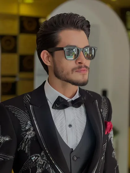 A closer look at this gentleman's event-ready style. The hair is expertly coiffed to stay in place while looking effortlessly stylish.