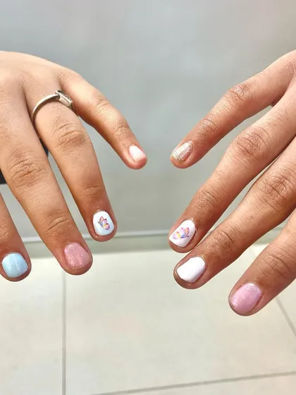 Sister love. This picture shows how great short nails can look with cute, matching designs. A perfect example of a subtle, stylish manicure.