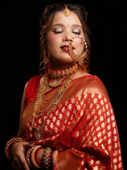 A serene portrait of the Pahadi bride, her eyes closed to showcase the beautiful eye makeup.