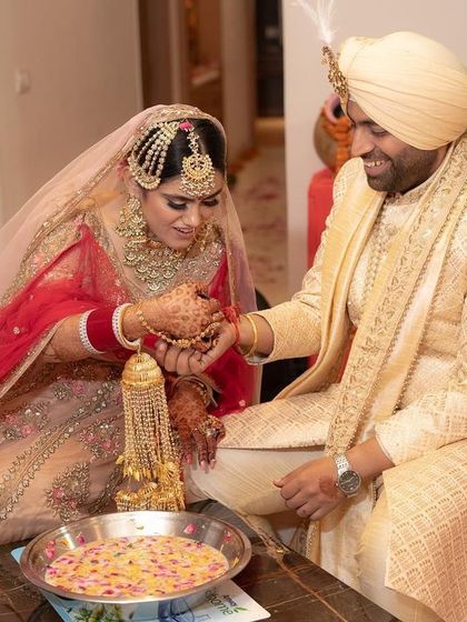 Another joyful moment from the traditional ring-finding game, a fun-filled ritual that we love to capture.