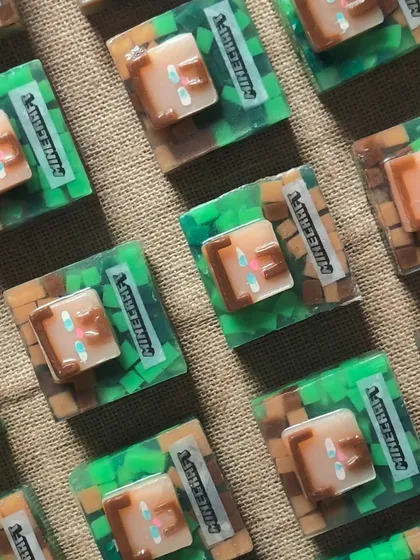 A close-up of the detailed Minecraft soaps, a perfect return gift for a gaming-themed birthday party.