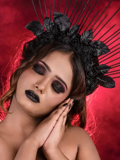 A color version of the dark fantasy look, showing the subtle purple and black tones in the eyeshadow. The black lipstick and nails complete this gothic-inspired character makeup.