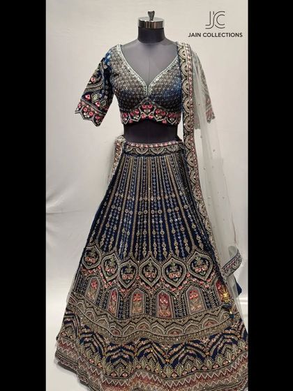 This royal blue velvet lehenga on a mannequin is a true beauty. The detailed embroidery makes it a perfect choice for a winter wedding reception or the main ceremony.