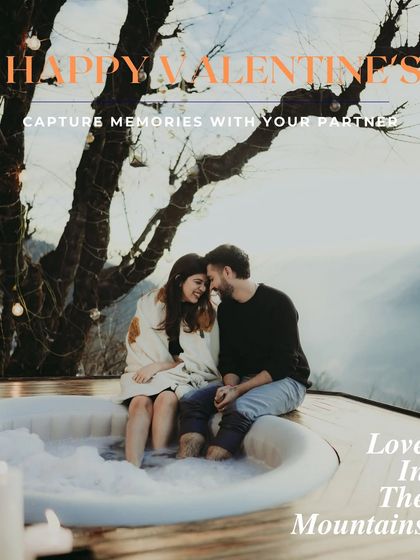 A Valentine's Day special, this image captures a cozy couple in an outdoor tub with a mountain view, perfect for a romantic getaway shoot.