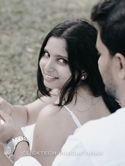 An over-the-shoulder shot capturing the bride's beautiful smile during a picnic in Coorg.