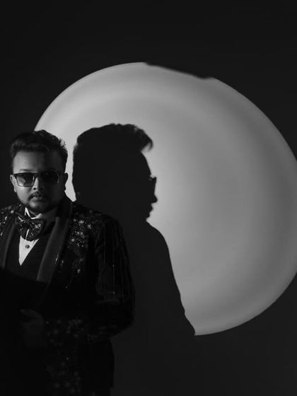 Another creative black and white portrait of the groom, playing with light and shadow.