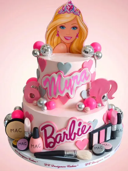 This two-tier Barbie cake was inspired by a design created with AI. It features edible makeup, disco balls, and a Barbie topper, showing how I can bring even the most imaginative digital concepts to life.