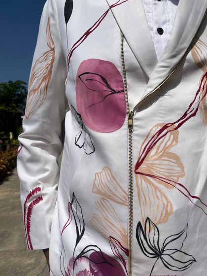 A close-up of the abstract floral patterns on a custom carnival jacket. I use bold lines and a mix of soft and vibrant colors to create a design that is both artistic and wearable.