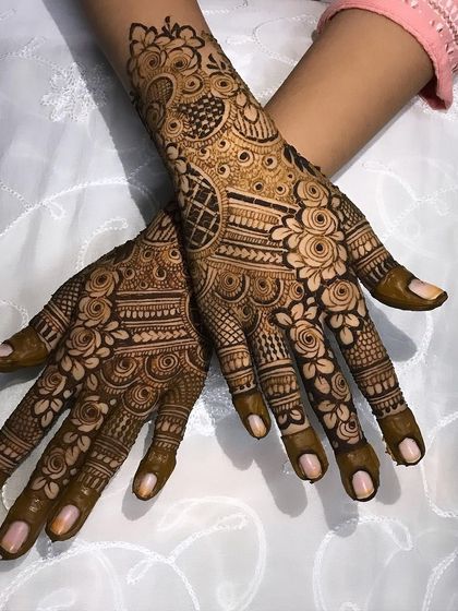 A beautiful bridal design with a focus on rose motifs, combined with detailed check and dot patterns for a full and festive look.