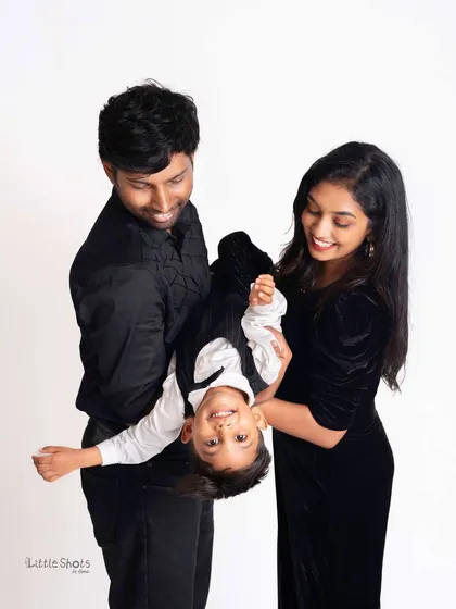 Let the fun begin! I encourage playful and energetic moments during my family shoots. This shot of a little boy being held upside down by his parents captures the pure, chaotic joy of family life.