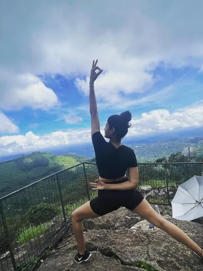 On a clifftop in Munnar, with the world stretching out below, even a simple warrior variation feels powerful. The expansive view and open sky encourage a sense of freedom and strength in the body and mind.
