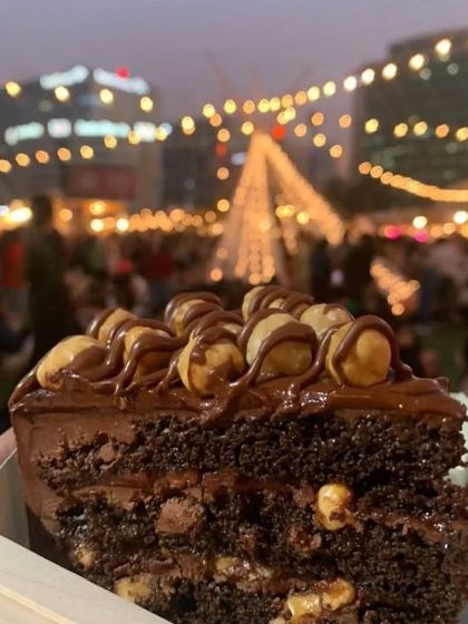 A slice of our Nutella Hazelnut cake against the beautiful bokeh background of The Lil Flea. We can't wait to be back.