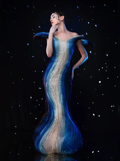 We push creative boundaries by blending art and fashion. This celestial-inspired couture piece is set against a projected starry night, showing students how to create otherworldly and imaginative editorial shots.