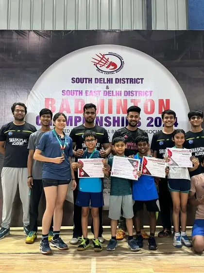 A group of my students and coaches celebrating their wins at the district badminton championship. We bagged 17 medals in total, a testament to the quality of our training programs.